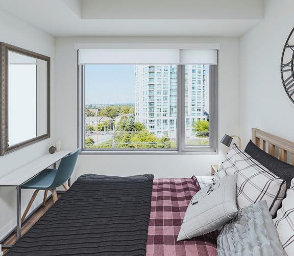 Bedroom with picture window & walk-in closet