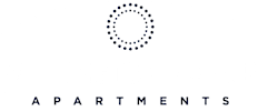 The image is a logo for Wellington Manor Apartments.