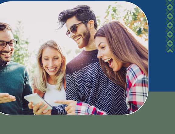 a group of people looking at a cell phone