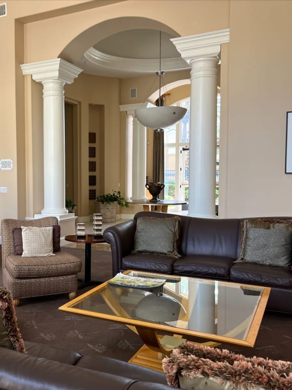 a living room with couches chairs and a coffee table