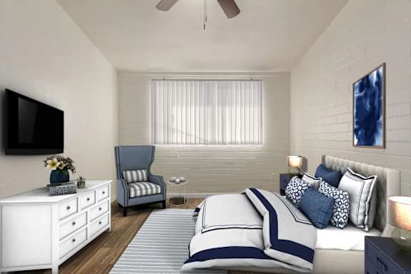 a bedroom with a bed and a tv