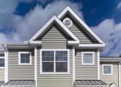 Thumbnail 2 of 3 - a house with two doors and a sidewalk in front of it