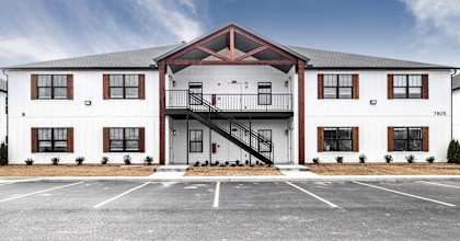 a building with a parking lot in front of it
