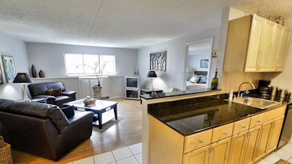 Living Room With Kitchen View at  Integrity Medina Apartments, Integrity Realty LLC, Medina