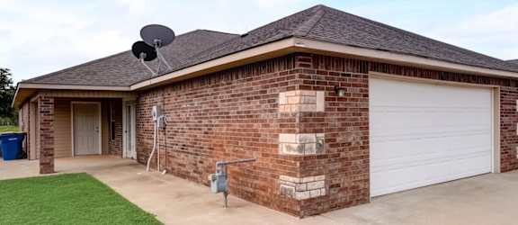 a house with a satellite dish on the roof