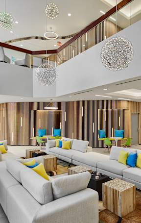 Lobby with Grey Couches at The Oxford Apartments, Oxon Hill, Maryland