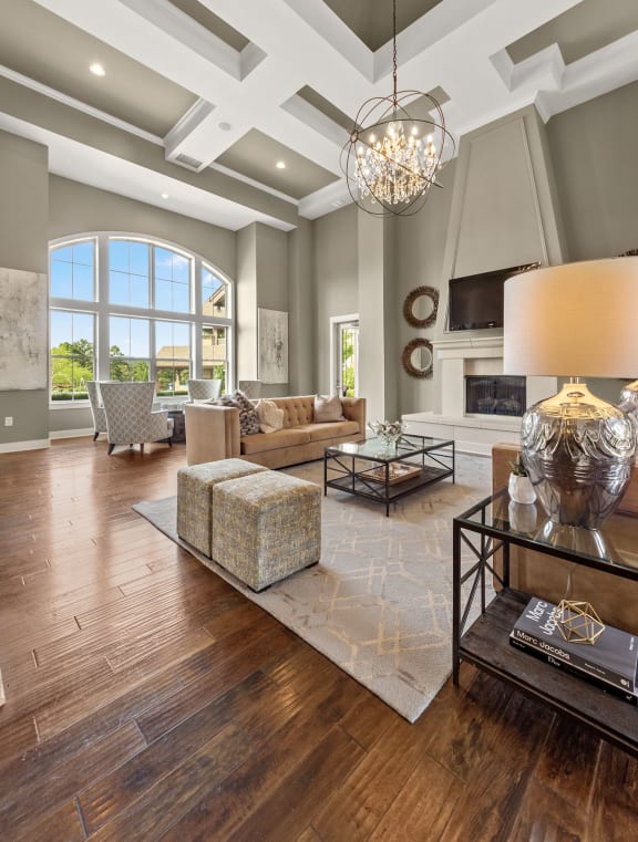 the living room has a large window and a coffered ceiling at The Ridge at Chenal Valley, Little Rock, Arkansas