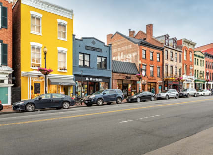 a city street with cars parked on the side of it