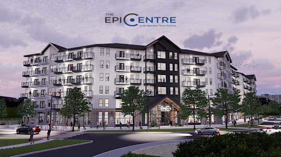 The EPICENTRE is a modern apartment building with a spacious entrance and multiple balconies.
