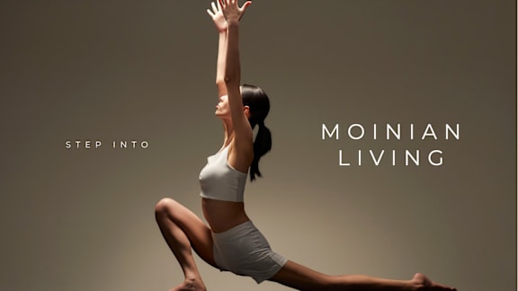 A woman is performing a yoga pose with the text "Step into Moinian Living" on the image.