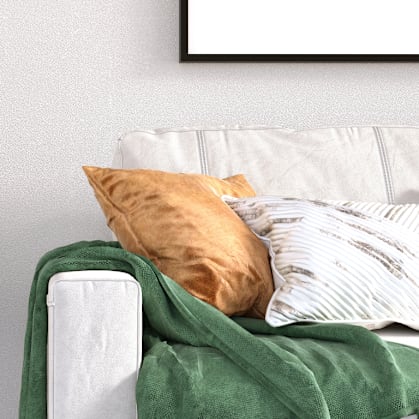 a bedroom with a bed and a nightstand with a vase of flowers on it