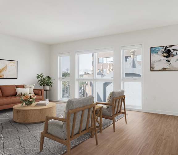 A living room with a couch, two chairs, and a coffee table.