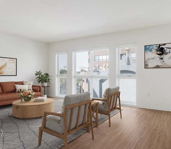 A living room with a couch, two chairs, and a coffee table.