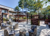 Thumbnail 10 of 50 - Outdoor seating at Commons at Redwood Creek Apartments, Beaverton, OR