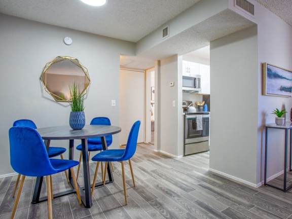 A living room with two chairs and a table.