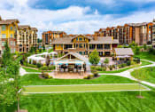 Thumbnail 1 of 42 - an aerial view of a large building with a green lawn in front of it  at WaterCrest at City Center, Kansas
