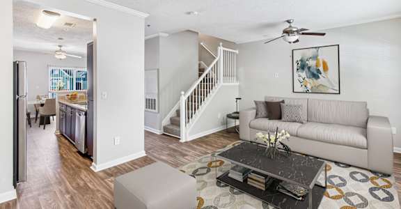 One K Apartments in Atlanta, GA photo of a living room with a couch and a table