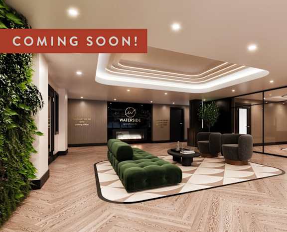 A modern living room with a green plant on the left and a sign that says "WATERSHIP" on the wall.