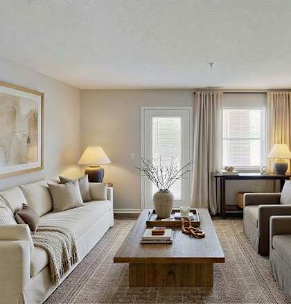 A living room with a couch, chairs, and a coffee table. at Arbors at Hickory Creek Apartments , Illinois