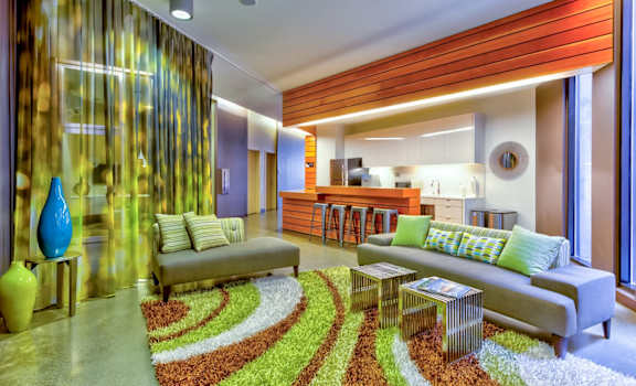 a living room filled with furniture and a large window