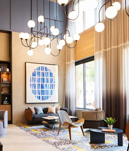 the lobby with chairs and couches