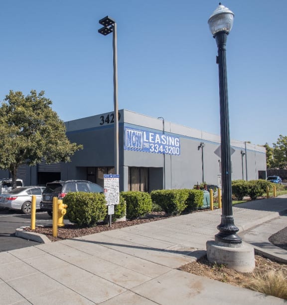North McClellan Now Leasing Sign and Parking Lot Sidewalk