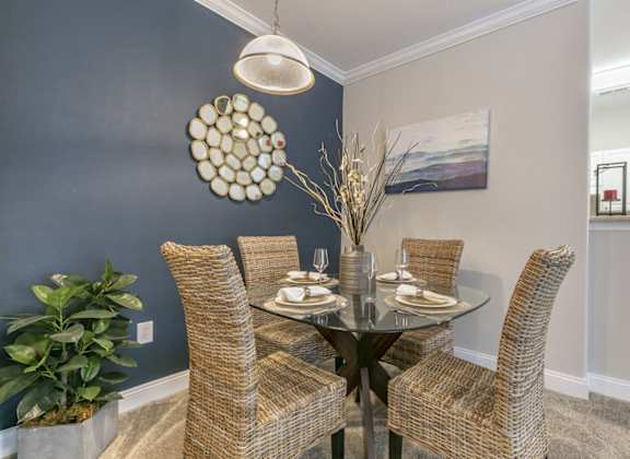 a dining room with a table and chairs