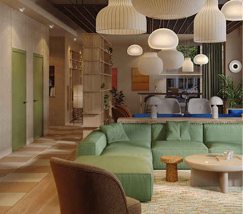 A modern living room with a green sofa and a brown chair.