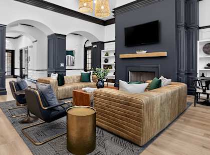 A living room with a fireplace and a couch.