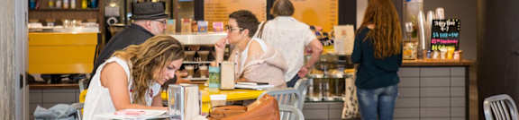 people sitting at tables at a restaurant at Parcels at Concourse, Memphis, Tennessee