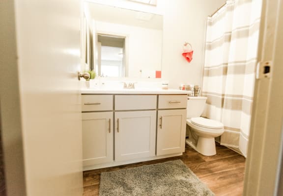 a bathroom with white cabinets and a shower and a toilet at Crown Pointe, Lakewood, WA, 98499