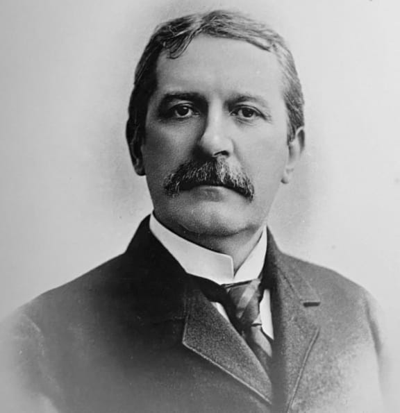 a portrait of a man in a suit and tie