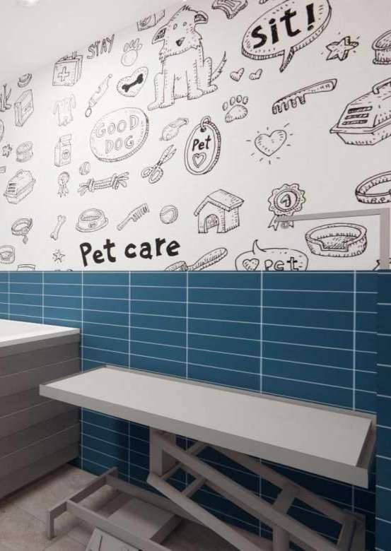 A pet care room with a white counter and blue tiled walls.