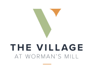 the logo for the village at women's mill