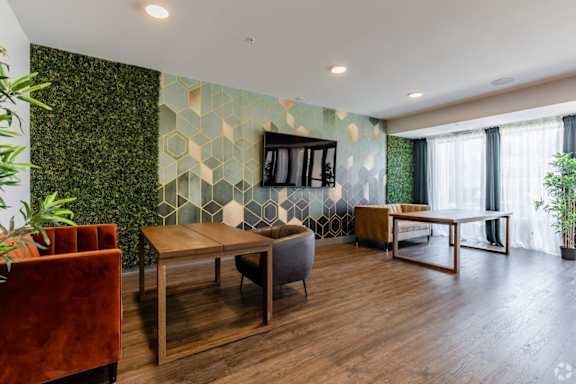 a living room with couches and tables and a television