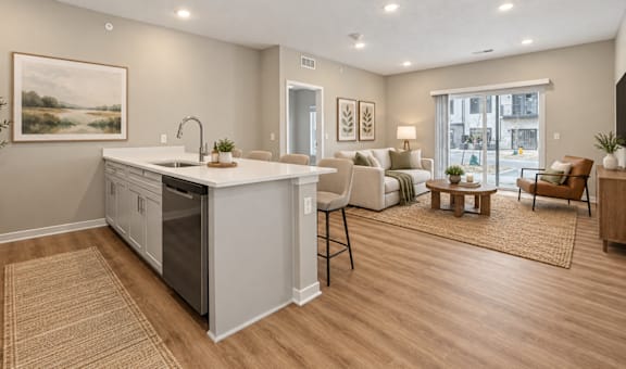 A modern kitchen with a large island and a dining area with a view of the city.