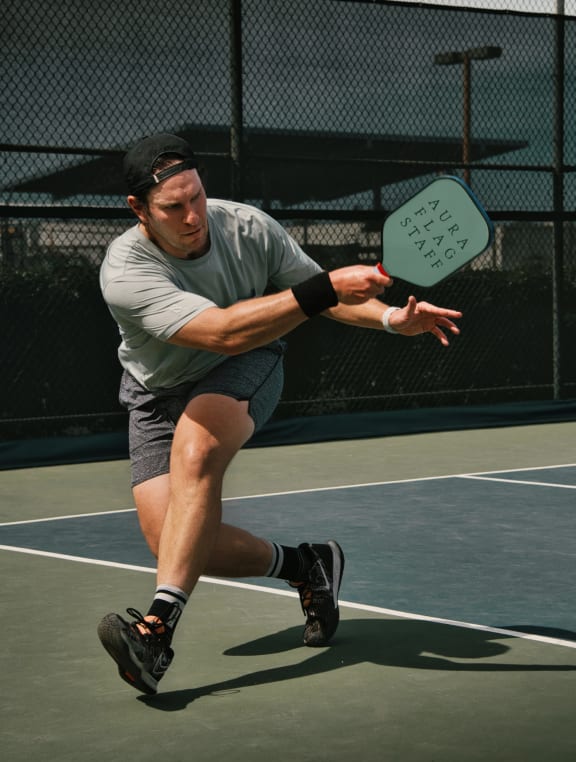 Man Wearing Hat and Playing Pickleball
