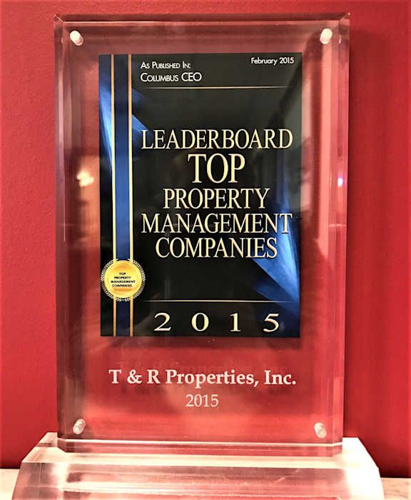 An award plaque for top property management companies in 2015.