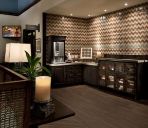 a kitchen with a large island with a marble countertop