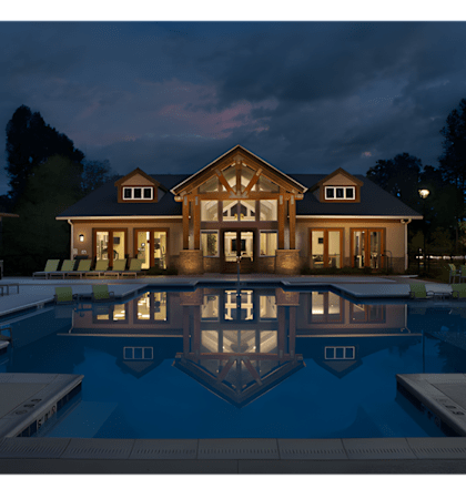 a house with a swimming pool at night