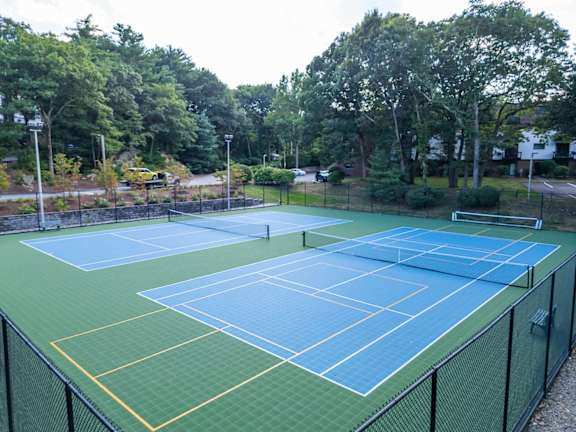 a couple of tennis courts on a tennis court