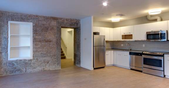 Luxury Vinyl Plank Flooring In Kitchen And Living Room at Ames Shovel Works Apartments, North Easton, MA