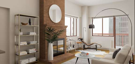 A living room with a fireplace, a sofa, and a coffee table at The Ellington Apartments, New York, NY, 10019