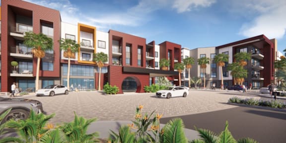 A modern apartment complex with palm trees in front.