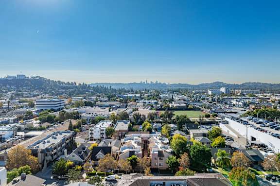 A cityscape with buildings and a clear sky.