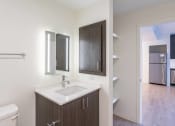 Thumbnail 8 of 8 - an empty bathroom with a sink and two mirrors