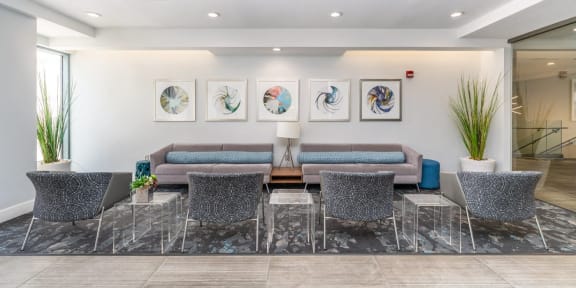 a living room with couches and a table with chairs