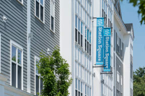 a picture of a building with a blue and white sign on the side of it