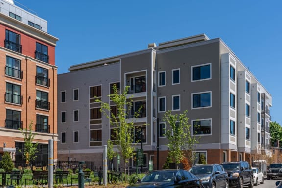 a new apartment building with cars parked in front of it at Union 346, Somerville, 02143