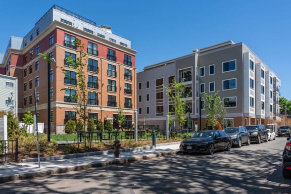 a rendering of a new apartment building on a city street at Union 346, Somerville, MA, 02143